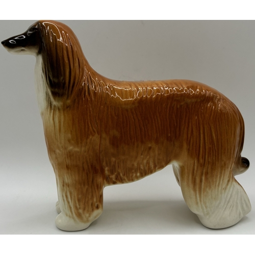 38 - Collection of 3 Lomonosov (Russian) dog figures. Tallest 16cm.