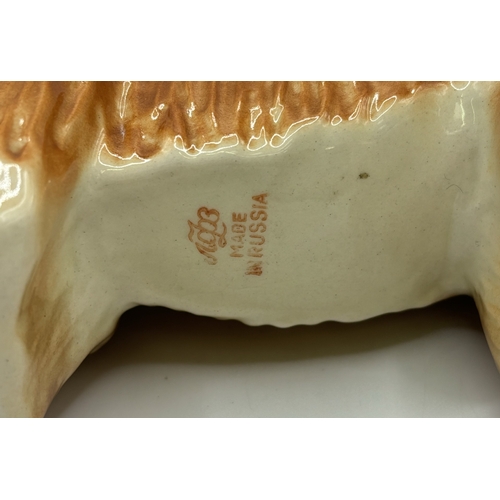 38 - Collection of 3 Lomonosov (Russian) dog figures. Tallest 16cm.