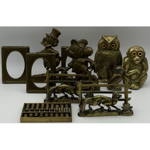 137 - Collection of vintage brass decor. To include pair of original Disney photo frames; letter holders, ... 