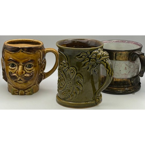 141 - Collection of vintage mugs, together with a mustard spoon. Makers include Royal Doulton, Royal Barum... 