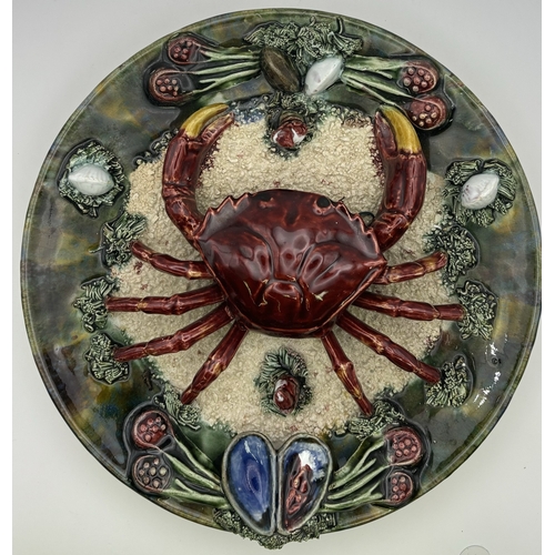 142 - Collection of 12 vintage wall decor. To include display plates, unusual crab plate & shells.
