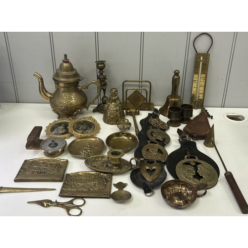 146 - Large collection of decorative brassware. To include horse brasses, compass, teapot, candle snuffer,... 