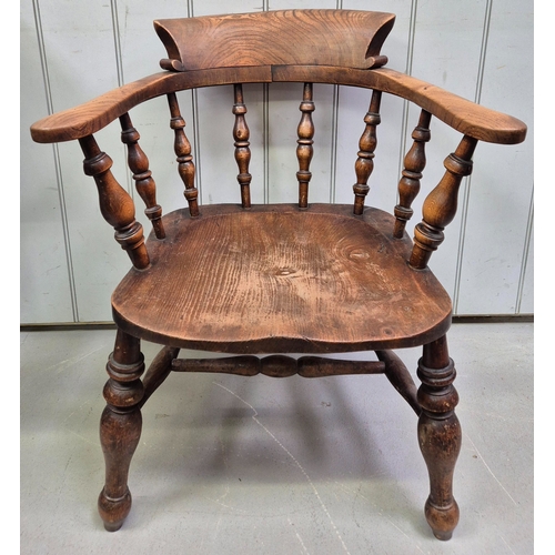 151 - 19th century smoker's oak bow armchair. Dimensions(cm) H77(41 to seat), W66, D46.