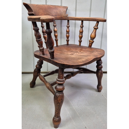 151 - 19th century smoker's oak bow armchair. Dimensions(cm) H77(41 to seat), W66, D46.