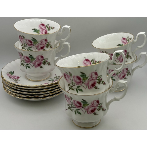 161 - Royal Albert Pink Roses part tea set. To include 6 cups, saucers & side plates, together with a milk... 