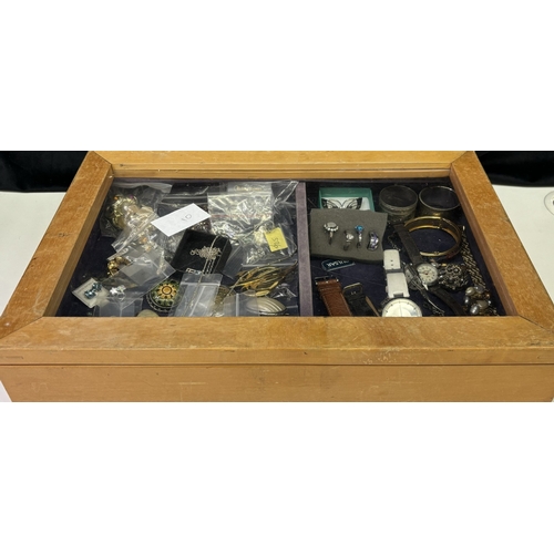 162 - Tabletop cabinet full of silver & costume jewellery, together with a selection of dress watches. To ... 