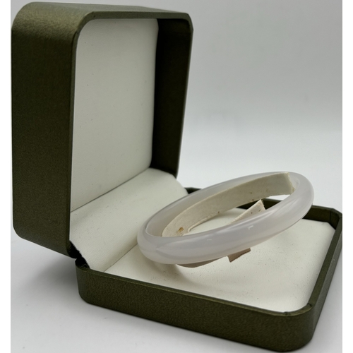 163 - Presentation boxed Jade bangle. Internal diameter 6.5