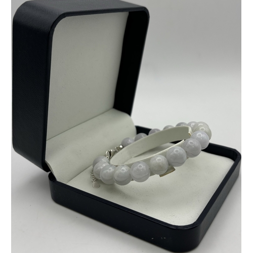 164 - Presentation boxed Jade bead bracelet. 17 10mm beads. Length 19cm inc. clasp.