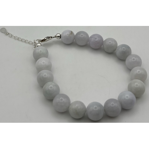 164 - Presentation boxed Jade bead bracelet. 17 10mm beads. Length 19cm inc. clasp.