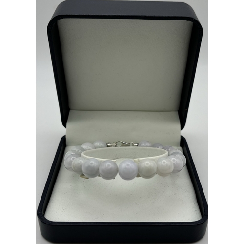 164 - Presentation boxed Jade bead bracelet. 17 10mm beads. Length 19cm inc. clasp.