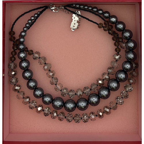 172 - Boxed Butler & Wilson three-strand necklace.