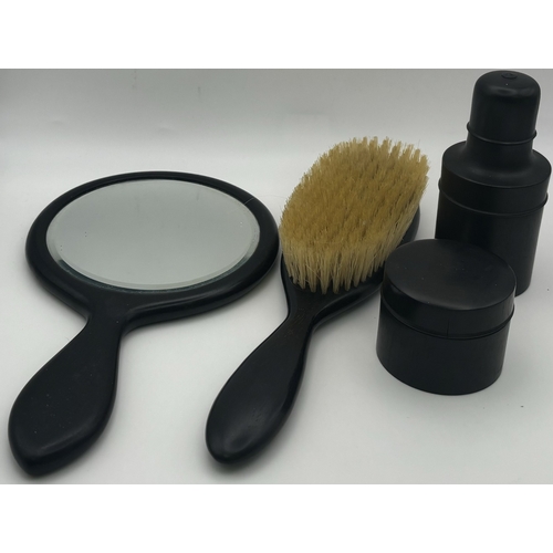 251 - Vintage 4-piece ebony dressing table set.