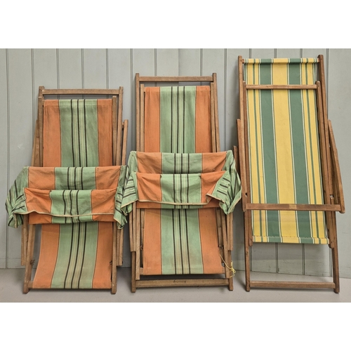 266 - Trio of vintage, folding deck chairs, including pair with canopies.