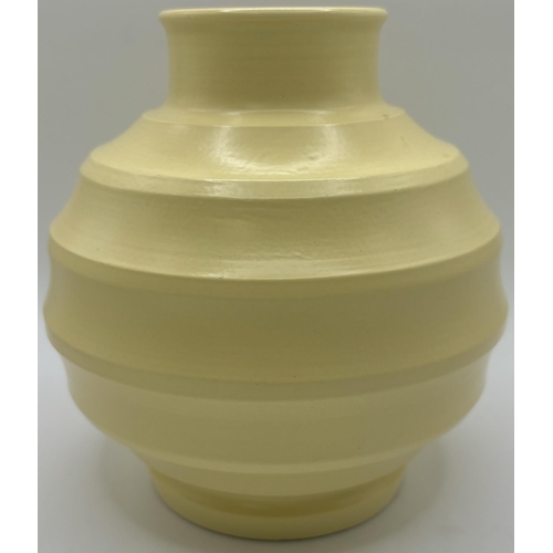 2710 - Keith Murray for Wedgwood ribbed 'football' vase, in matt straw glaze, printed marks to base, c.1930... 