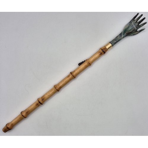 2774 - Early 20th century, brass Quran box, likely Moroccan; together with a vintage bamboo backscratcher.