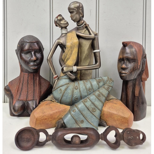 2776 - Pair of carved African busts, African love spoon & resin lovers figurine. Tallest 32cm.