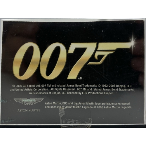 273 - Cased James Bond Goldfinger Aston Martin DB5 by G E Fabbri Ltd, together with a playworn Kinsmart 19... 