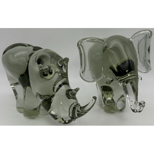 274 - Pair of handmade Ngwenya heavy glass animals. To include Elephant & Rhino. Respective heights 12.5cm... 