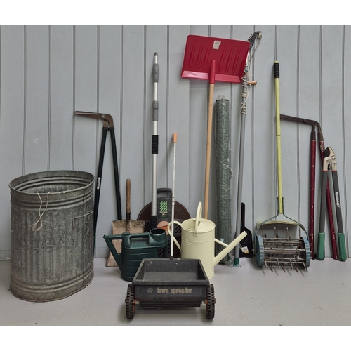 282 - Large collection of garden tools. To include lawn spreader, manual aerator, pruners, edger, shovel, ... 