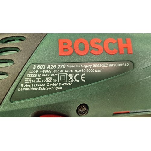 283 - Bosch PSB650E hammer drill, with case. Appears hardly used. PAT test pass & functionality test indic... 