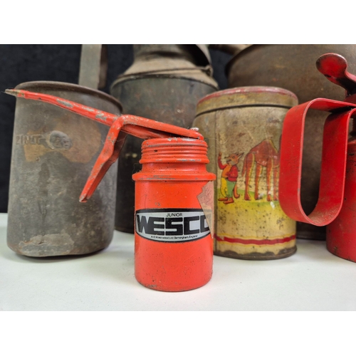 284 - Collection of vintage oil cans, blow torches & funnels.