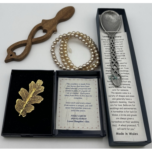293 - Large selection of costume jewellery. To include necklaces, bracelets, love spoon, brooch, etc.
