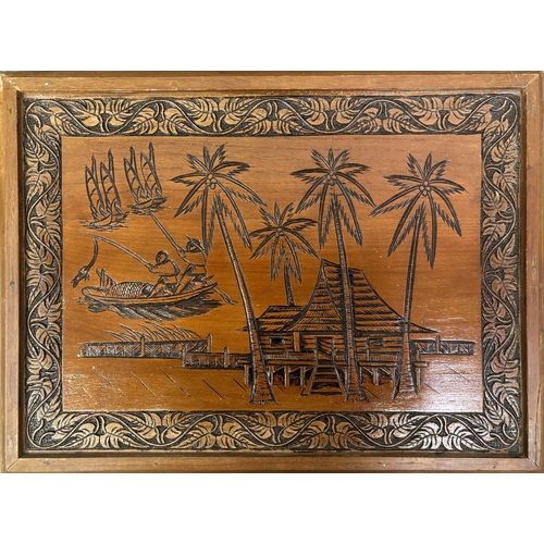 294 - Carved nest of 4 tables depicting an oriental scene. Complete with glass protectors. Largest dimensi... 