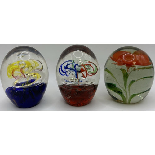 74 - Collection of 9 glass paperweights. Tallest 26cm.