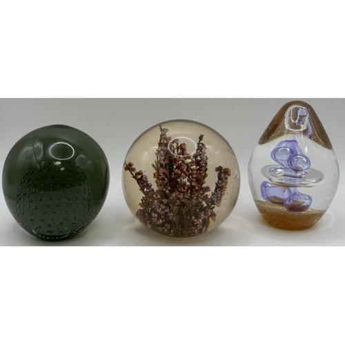 74 - Collection of 9 glass paperweights. Tallest 26cm.