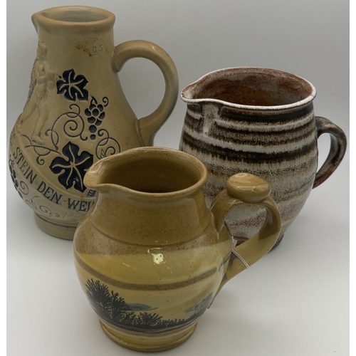 110 - Collection of 15 jugs. To include a Gluggle jug, Delft, etc.