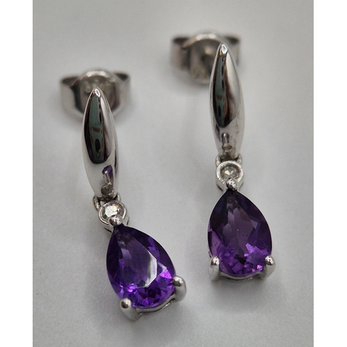 1701 - Presentation boxed, 9ct white gold earrings with amethyst set drops.