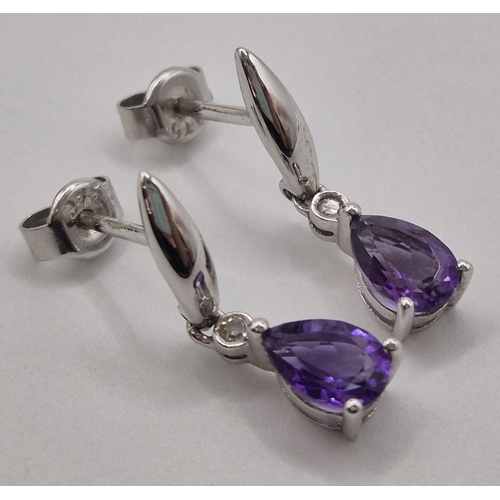 1701 - Presentation boxed, 9ct white gold earrings with amethyst set drops.