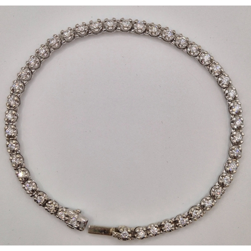 1702 - 9ct white gold tennis bracelet. Combined weight approx. 9.2g.