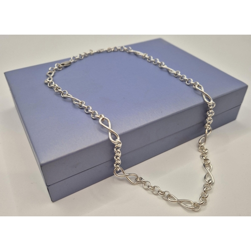 1708 - Tiffany & Co boxed silver necklace, together with another by David Christopher. Combined weight appr... 