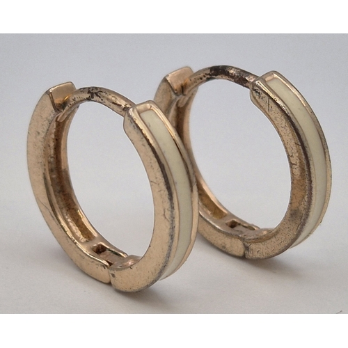 1736 - 9ct gold (acid tests as) hoop earrings. Combined weight approx. 1.53g.