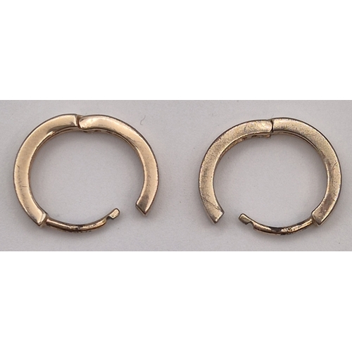 1736 - 9ct gold (acid tests as) hoop earrings. Combined weight approx. 1.53g.