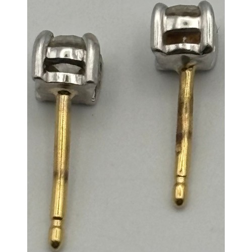 1752 - 18ct gold, hallmarked, single stone diamond earrings. Set in classic white gold, four-claw settings ... 