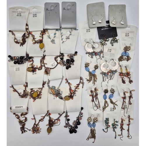 1753 - Large collection of costume jewellery. To include multiple retail carded earrings, bracelets, neckla... 