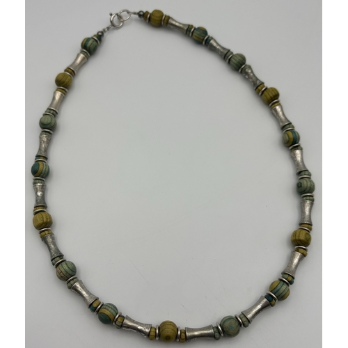 1765 - Selection of silver & white metal jewellery. Silver includes wooden beaded necklace, 16
