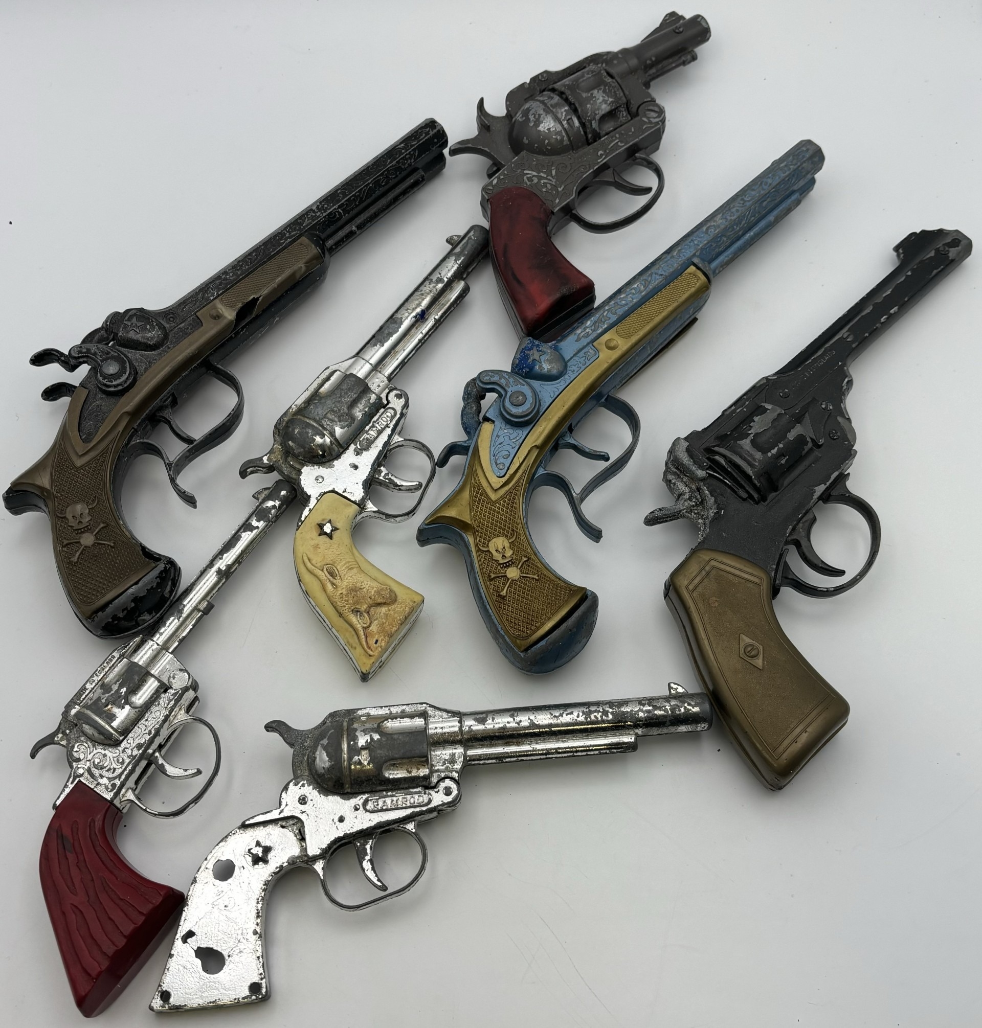 Collection of 7 vintage toy guns.