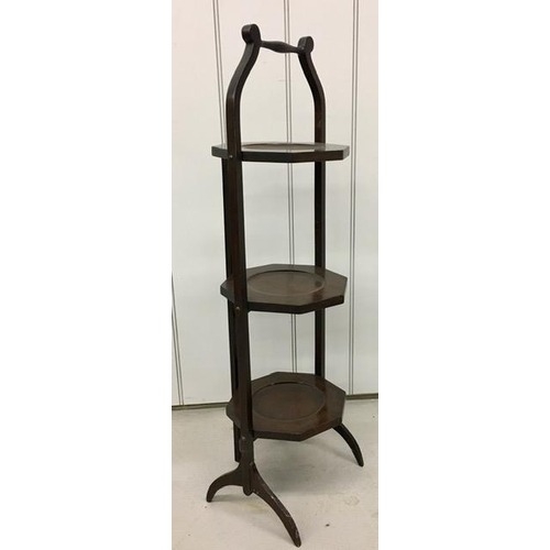 549 - Three-tiered, mahogany folding cake stand. Height 90 cm.