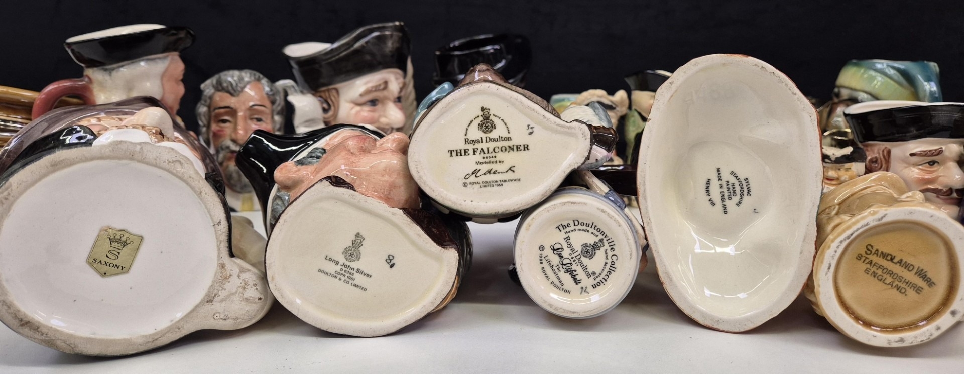 Large collection of 31 Toby jugs. Makers include Royal Doulton, Sylvac ...