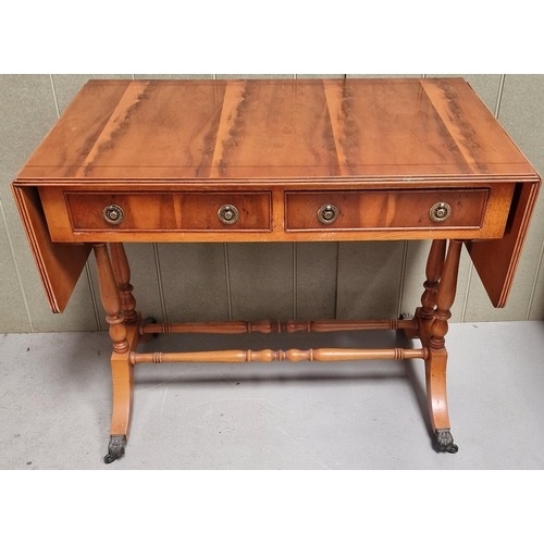 Regency yew writing table. Features drop leaf extensions, two drawers ...