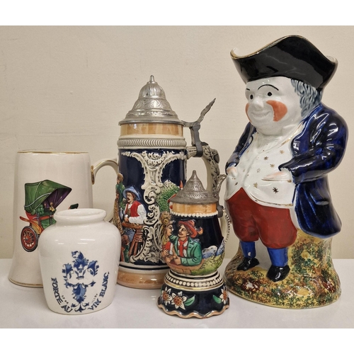 2101 - A mixed lot of ceramics. To include a large scale Toby jug, two steins (one musical), mug & jar.