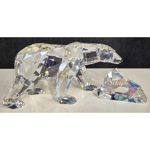 7089 - Swarovski model no: 1053154 2011 Siku Polar Bear with Iceberg Plaque

This retired Swarovski crystal... 