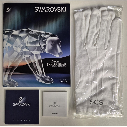 7089 - Swarovski model no: 1053154 2011 Siku Polar Bear with Iceberg Plaque

This retired Swarovski crystal... 