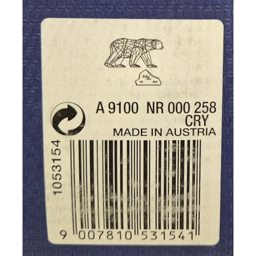 7089 - Swarovski model no: 1053154 2011 Siku Polar Bear with Iceberg Plaque

This retired Swarovski crystal... 