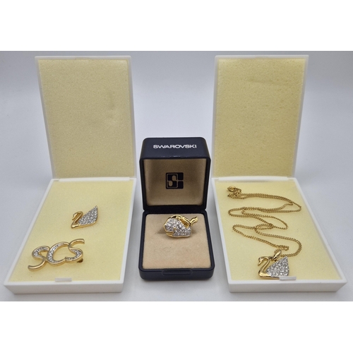 7077 - A collection of four pieces of Swarovski jewellery,  including three presentation-boxed. All appear ... 