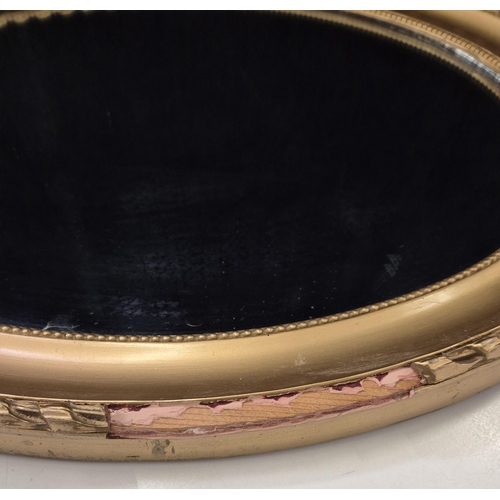Antique oval mirror, with gilded frame. Dimensions 49cm x 59cm.