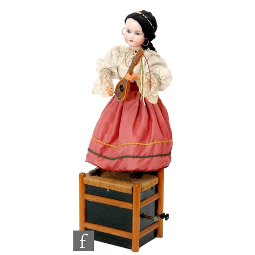 301 - An Armand Marseille bisque head doll automaton of a girl in Italian dress playing a mandolin with mo... 